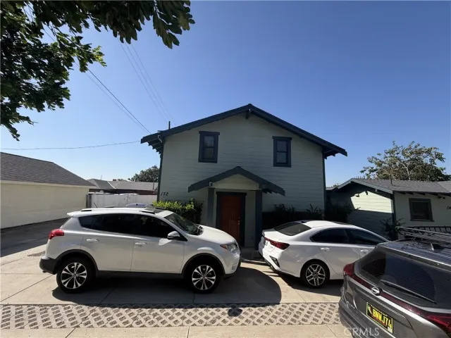 a car parked in front of a house