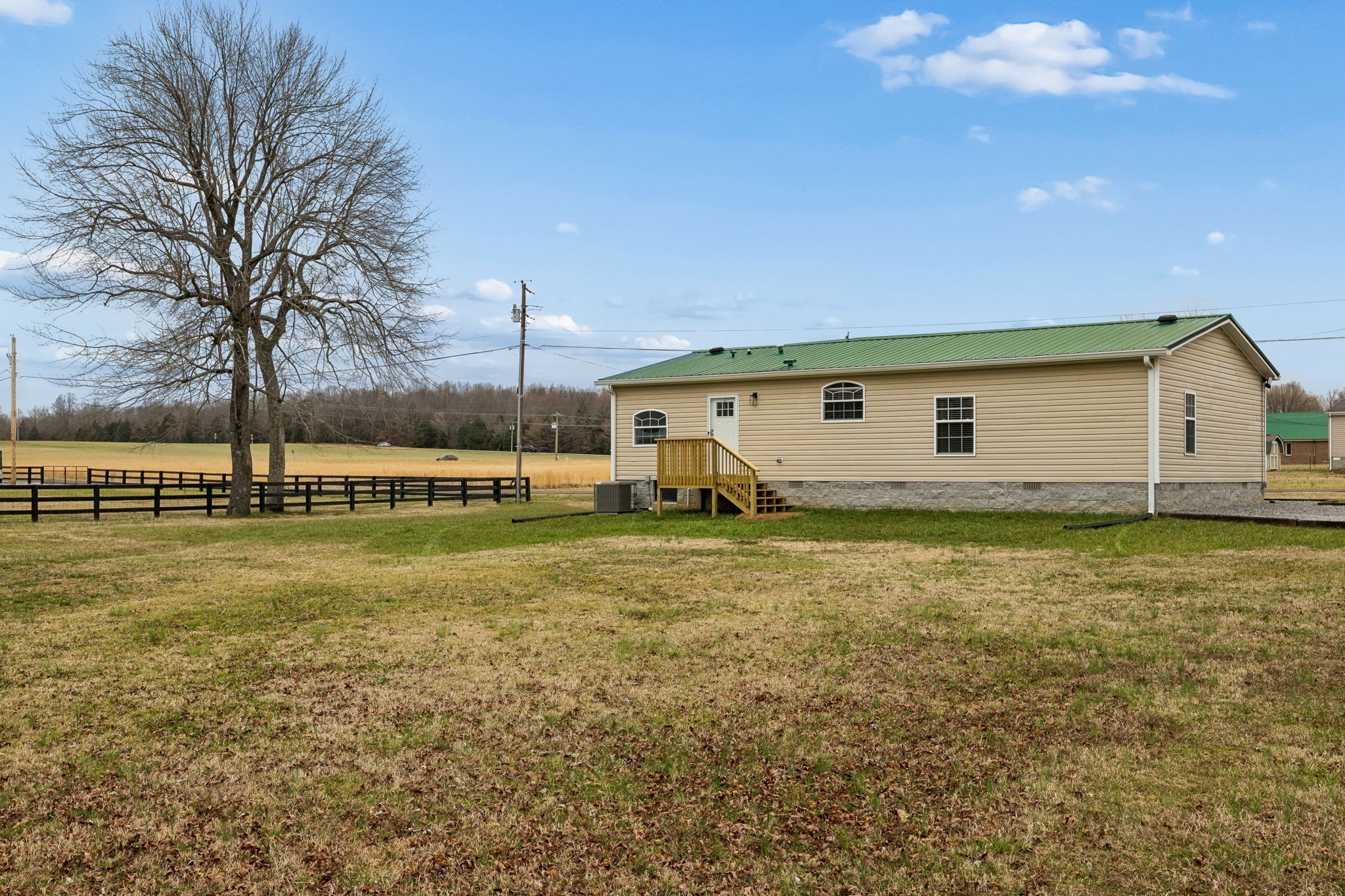 181 Duke Road Dickson, TN 37055 - Photo 18 of 22 a view of a house with a yard