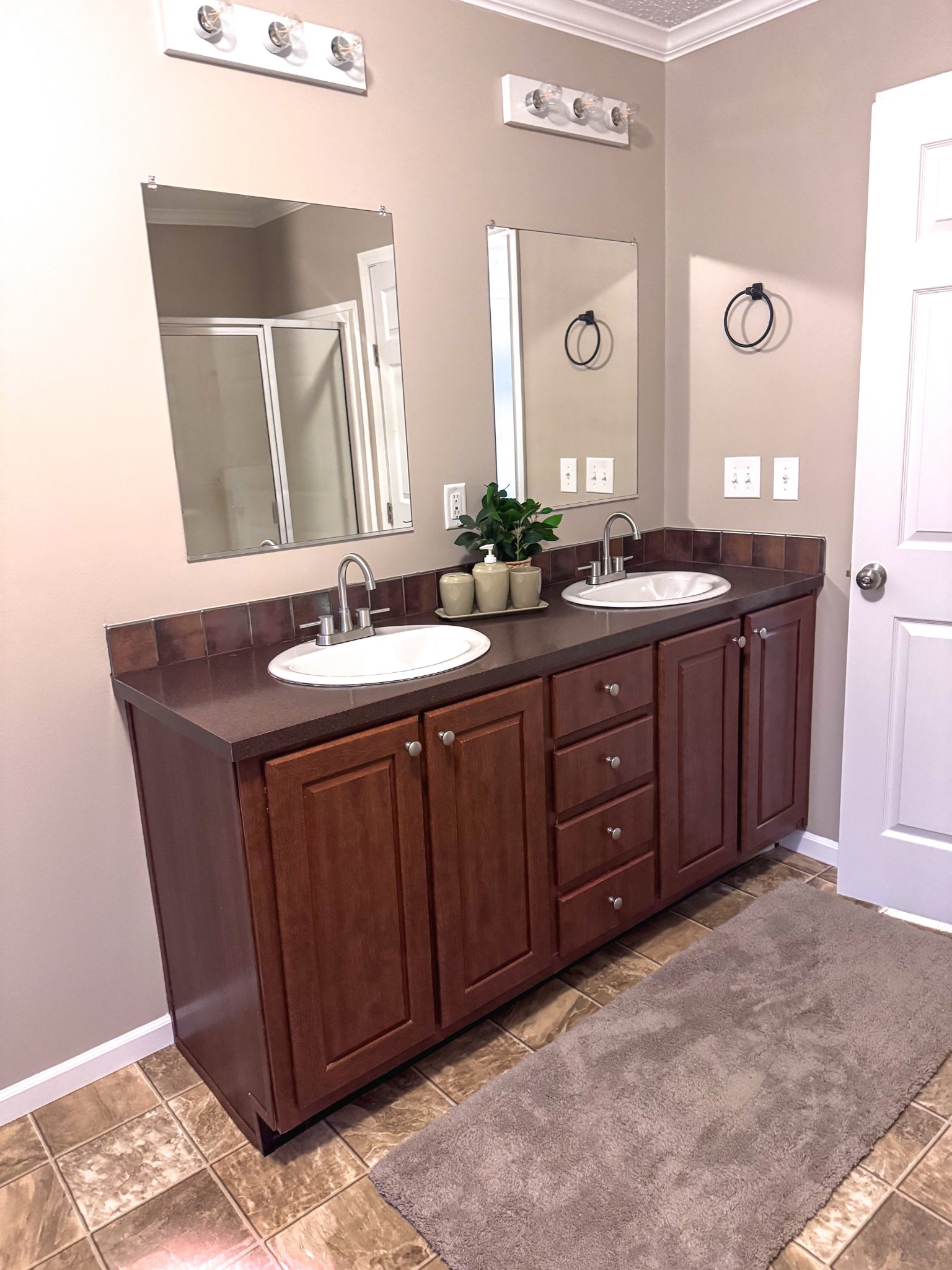 181 Duke Road Dickson, TN 37055 - Photo 9 of 22 a bathroom with a granite countertop double vanity sink and a mirror