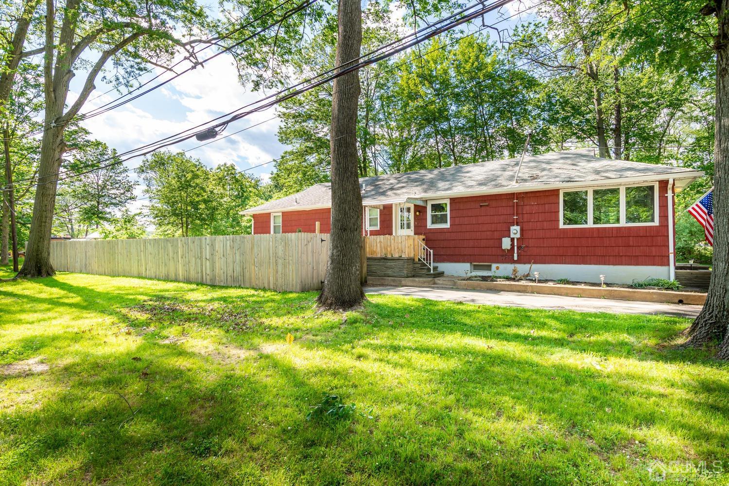 1337 Lower Ferry Road Ewing, NJ 08618 - Photo 3 of 40 a backyard of a house with table and chairs