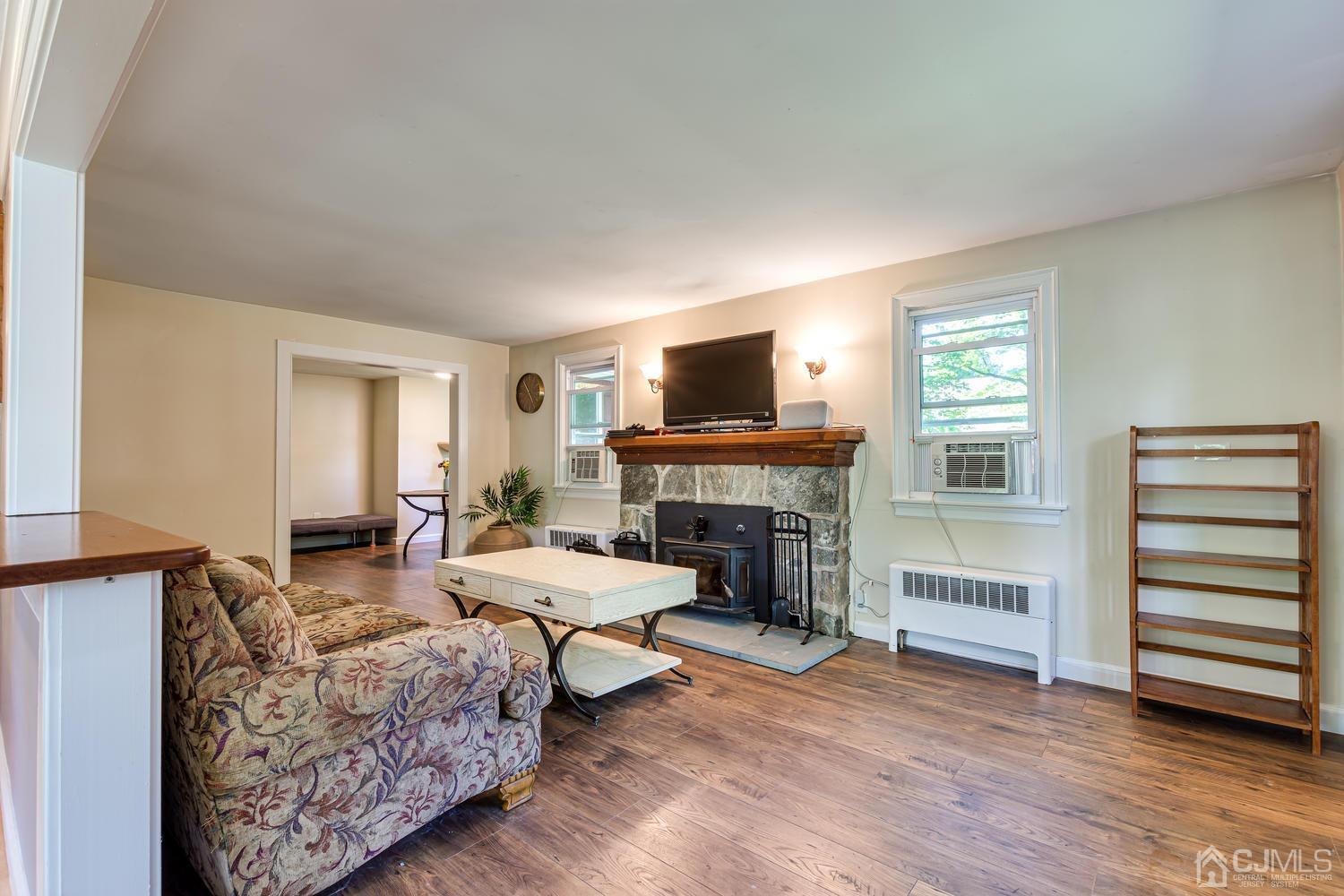 1337 Lower Ferry Road Ewing, NJ 08618 - Photo 8 of 40 a living room with furniture and a fireplace