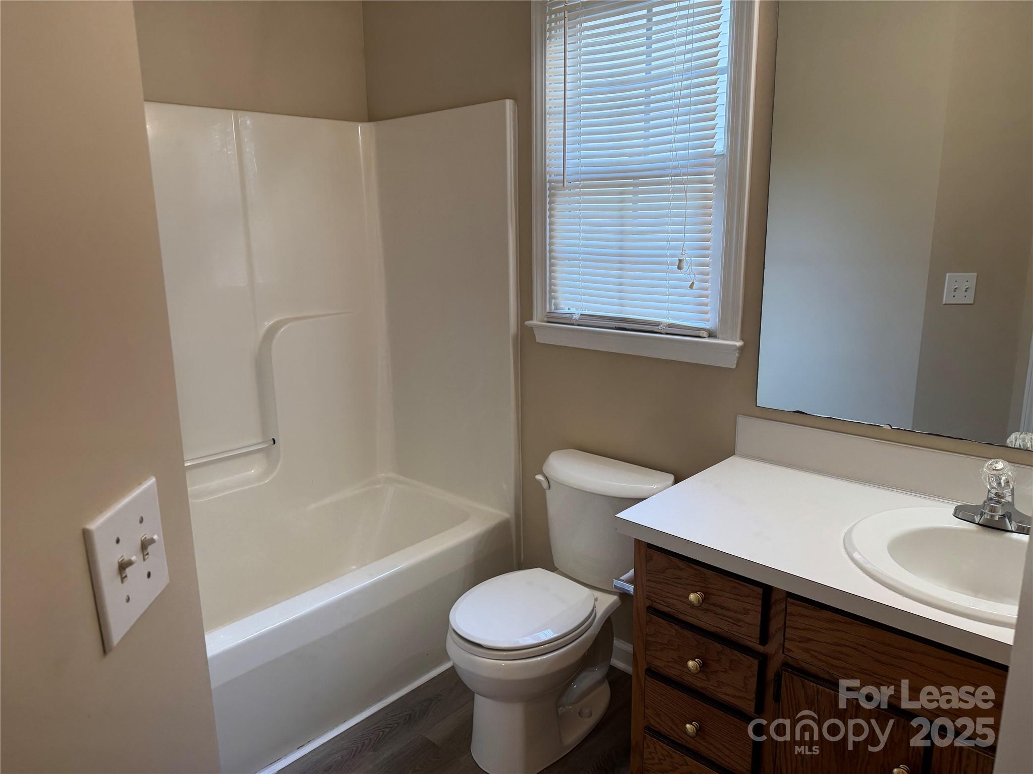 1424 Ridgewood Drive Concord, NC 28027 - Photo 11 of 14 a bathroom with a sink toilet and shower