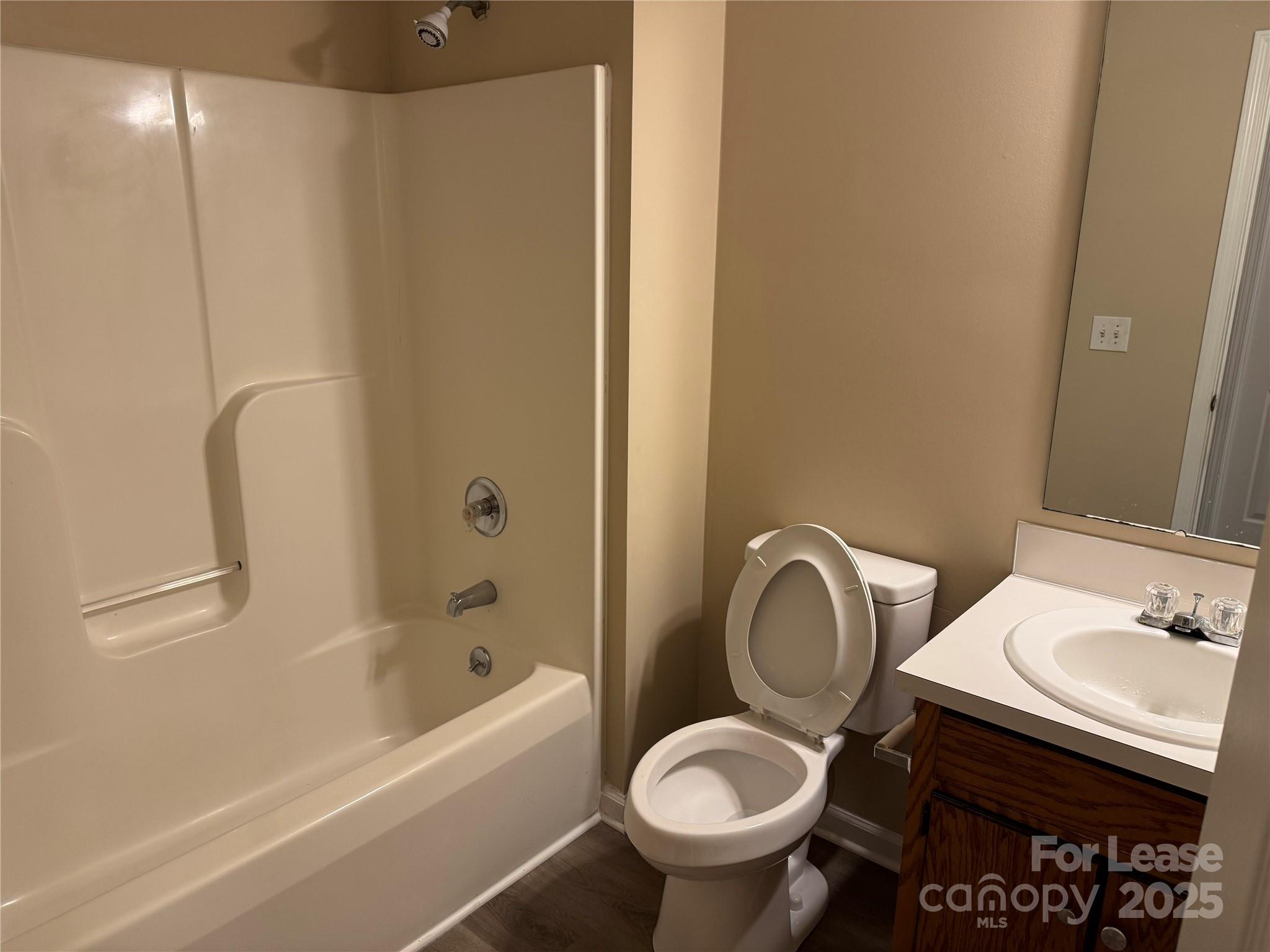1424 Ridgewood Drive Concord, NC 28027 - Photo 12 of 14 a bathroom with a sink toilet and shower