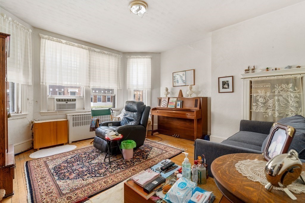 a living room with furniture and a rug