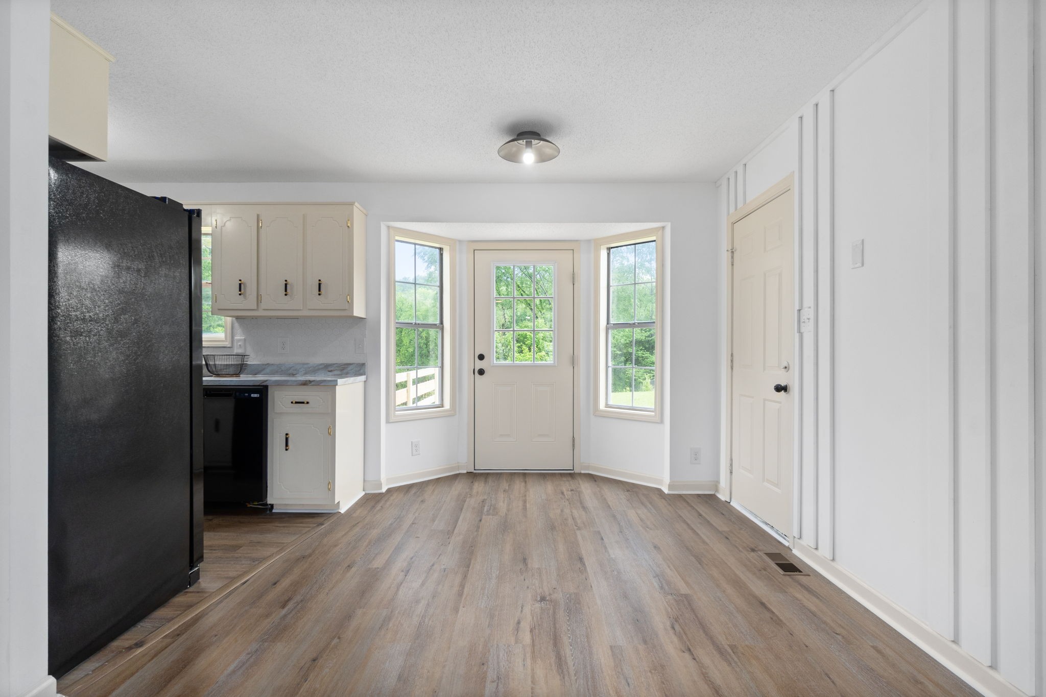 198 Cummings Creek Road Clarksville, TN 37042 - Photo 11 of 43 a view of kitchen with a refrigerator and wooden floor