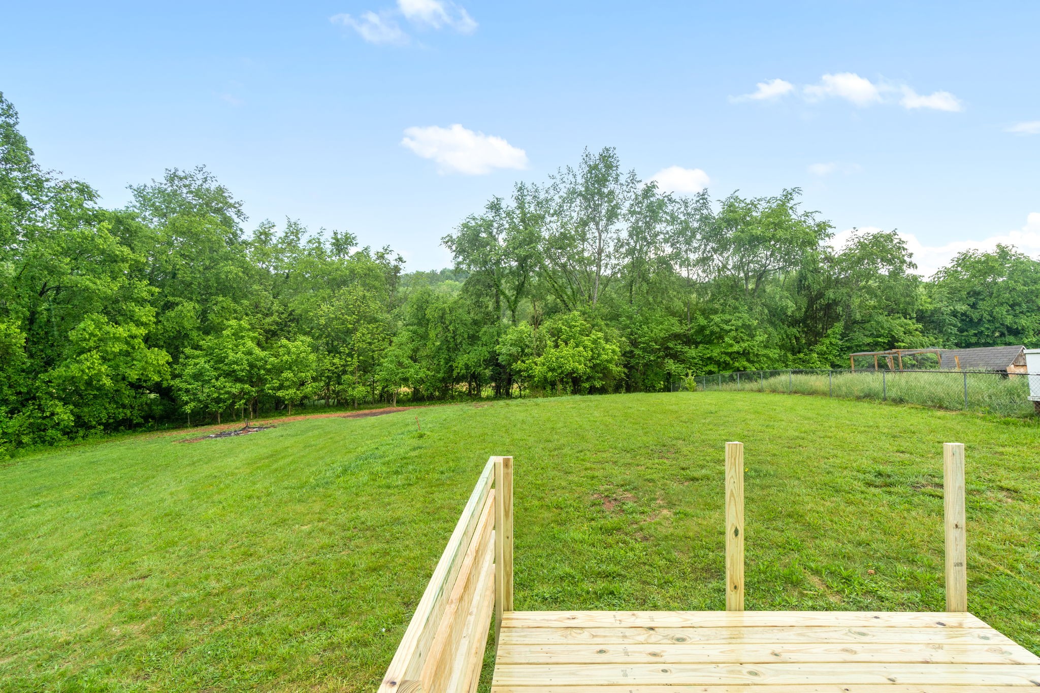 198 Cummings Creek Road Clarksville, TN 37042 - Photo 34 of 43 a backyard of a house with lots of green space