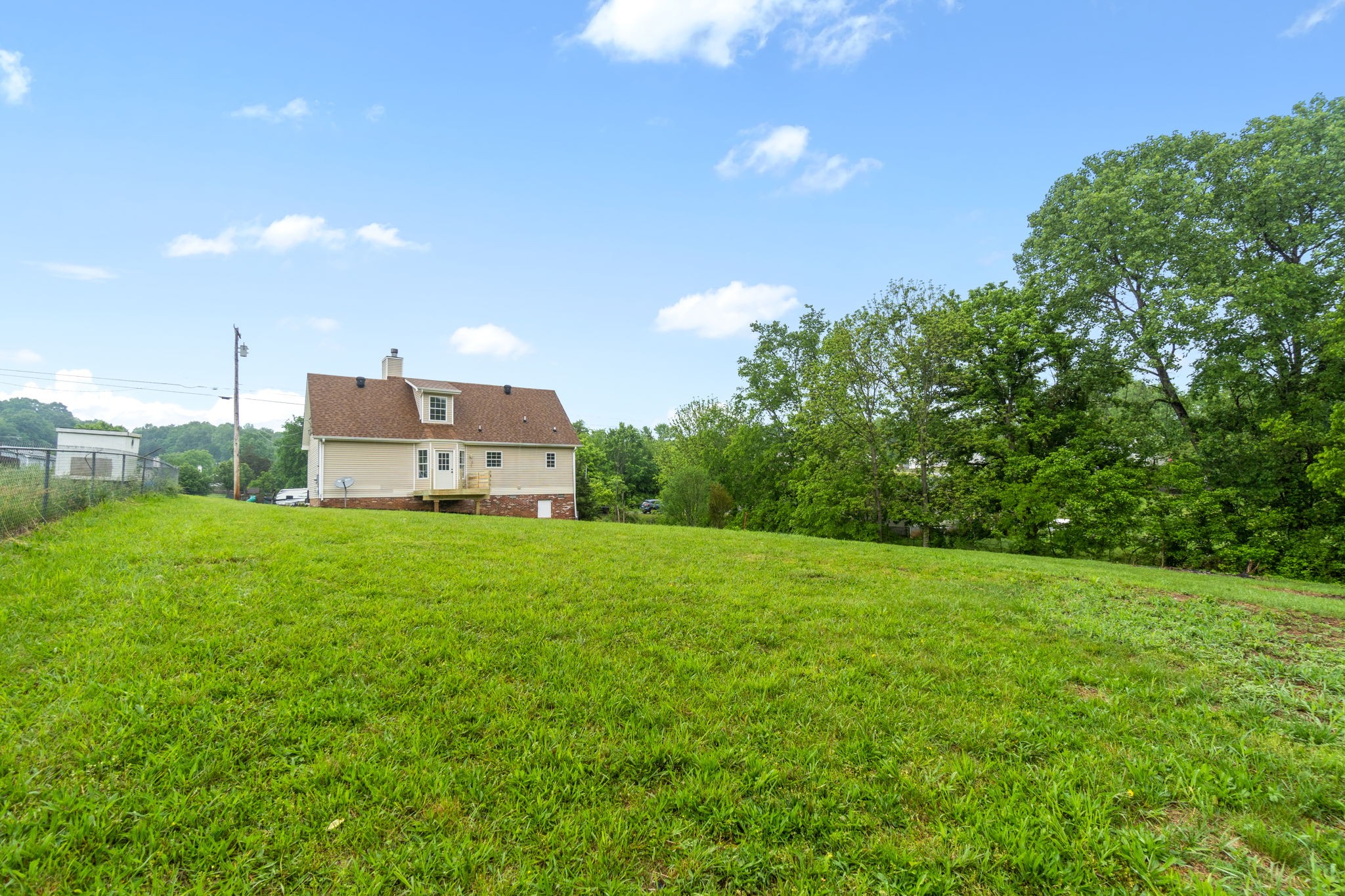 198 Cummings Creek Road Clarksville, TN 37042 - Photo 36 of 43 a view of a big yard with a house in the background