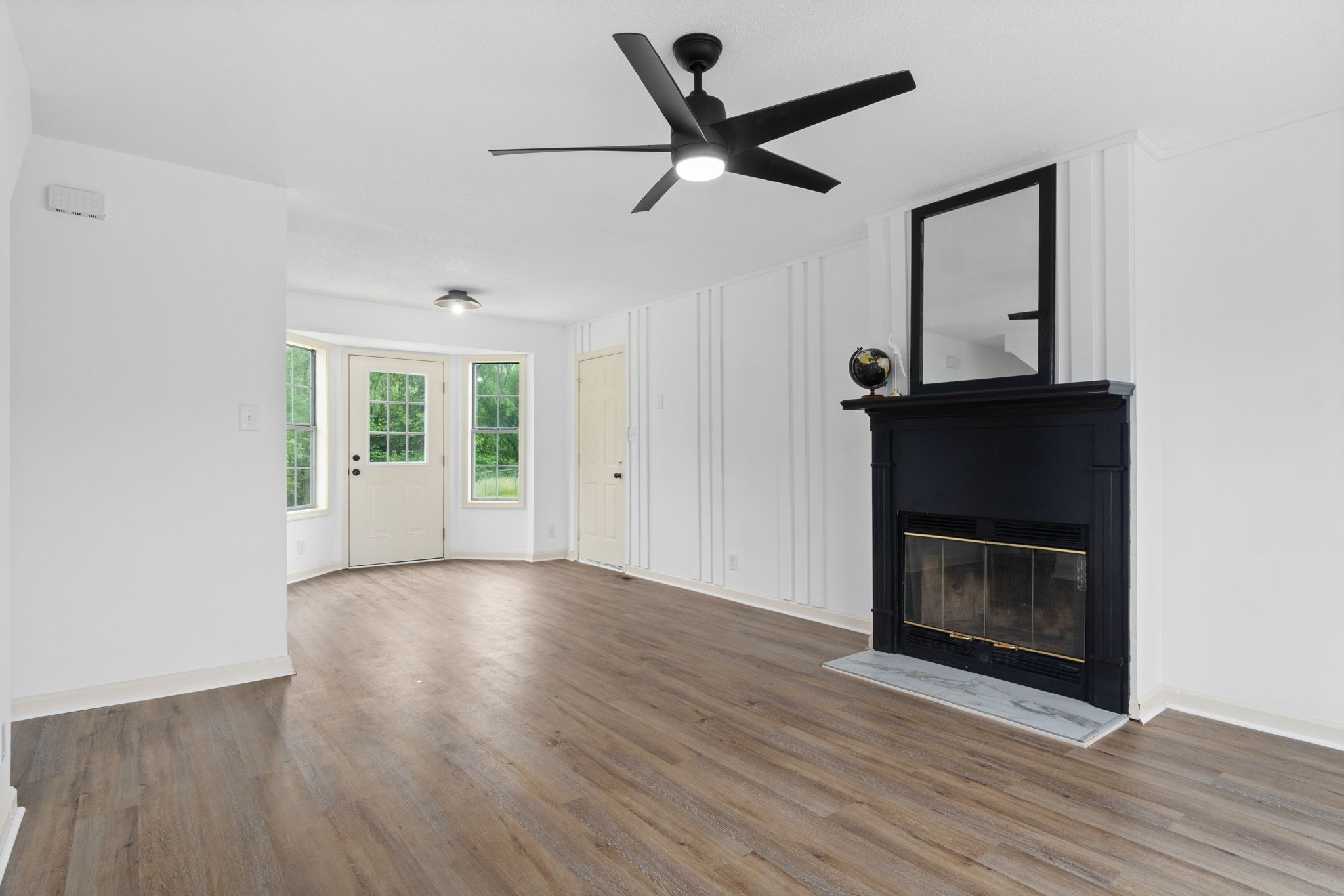 198 Cummings Creek Road Clarksville, TN 37042 - Photo 7 of 43 a living room with wooden floor and a fireplace