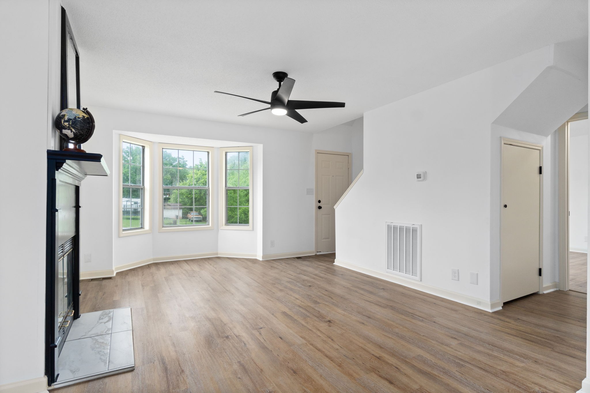 198 Cummings Creek Road Clarksville, TN 37042 - Photo 10 of 43 a view of a room with wooden floor chandelier and a ceiling fan