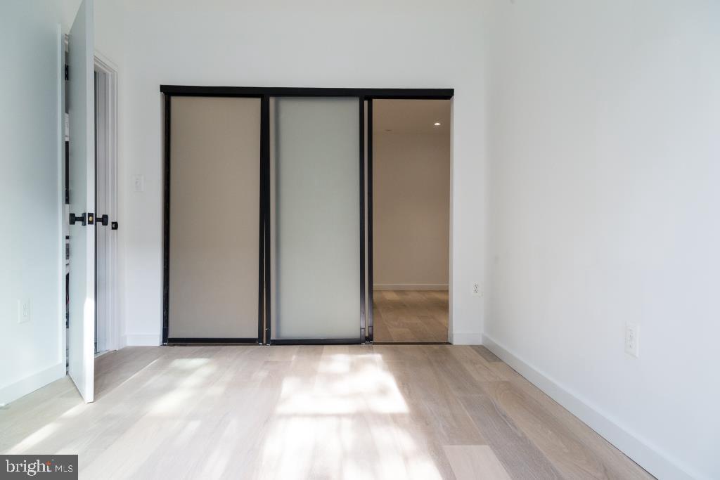 1443 Euclid Street Northwest, Unit 1 Washington, DC 20009 - Photo 11 of 14 a view of a room with an empty space
