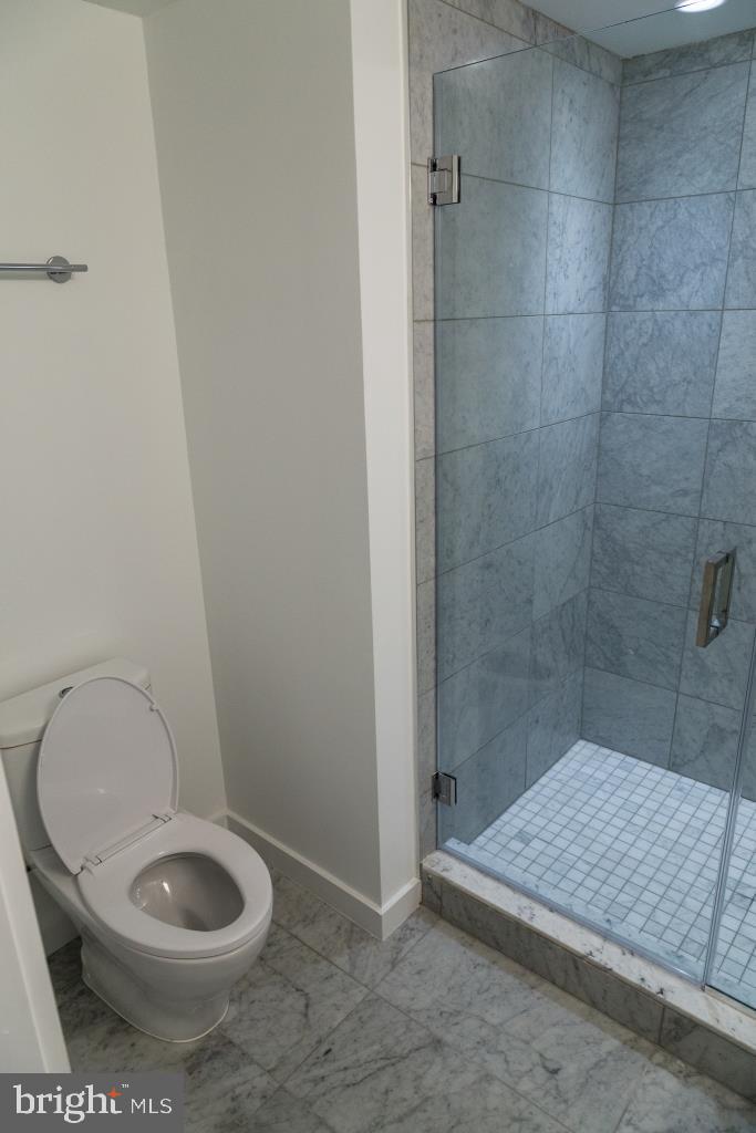 1443 Euclid Street Northwest, Unit 1 Washington, DC 20009 - Photo 14 of 14 a bathroom with a toilet and a shower