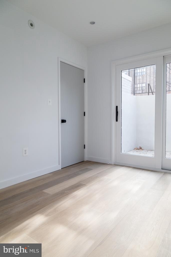 1443 Euclid Street Northwest, Unit 1 Washington, DC 20009 - Photo 7 of 14 a view of an empty room with a window