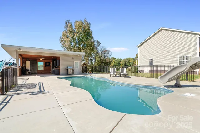a view of a swimming pool with a patio