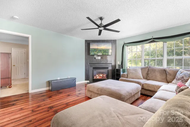 a bedroom with furniture and a fireplace