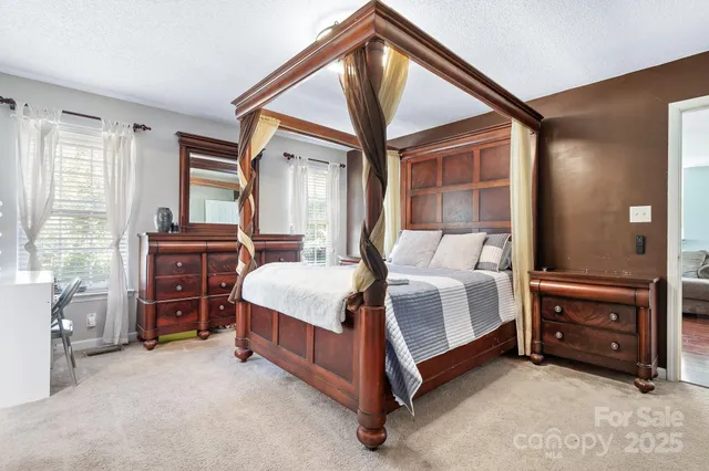 a bed room with a bed and a dresser