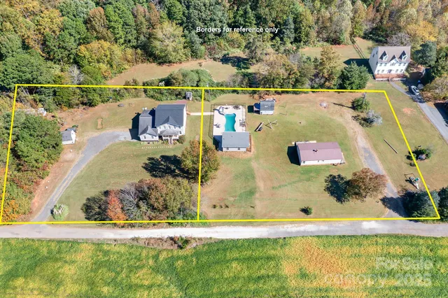 an aerial view of residential house with outdoor space