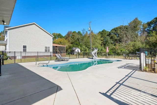 a view of a swimming pool with a patio