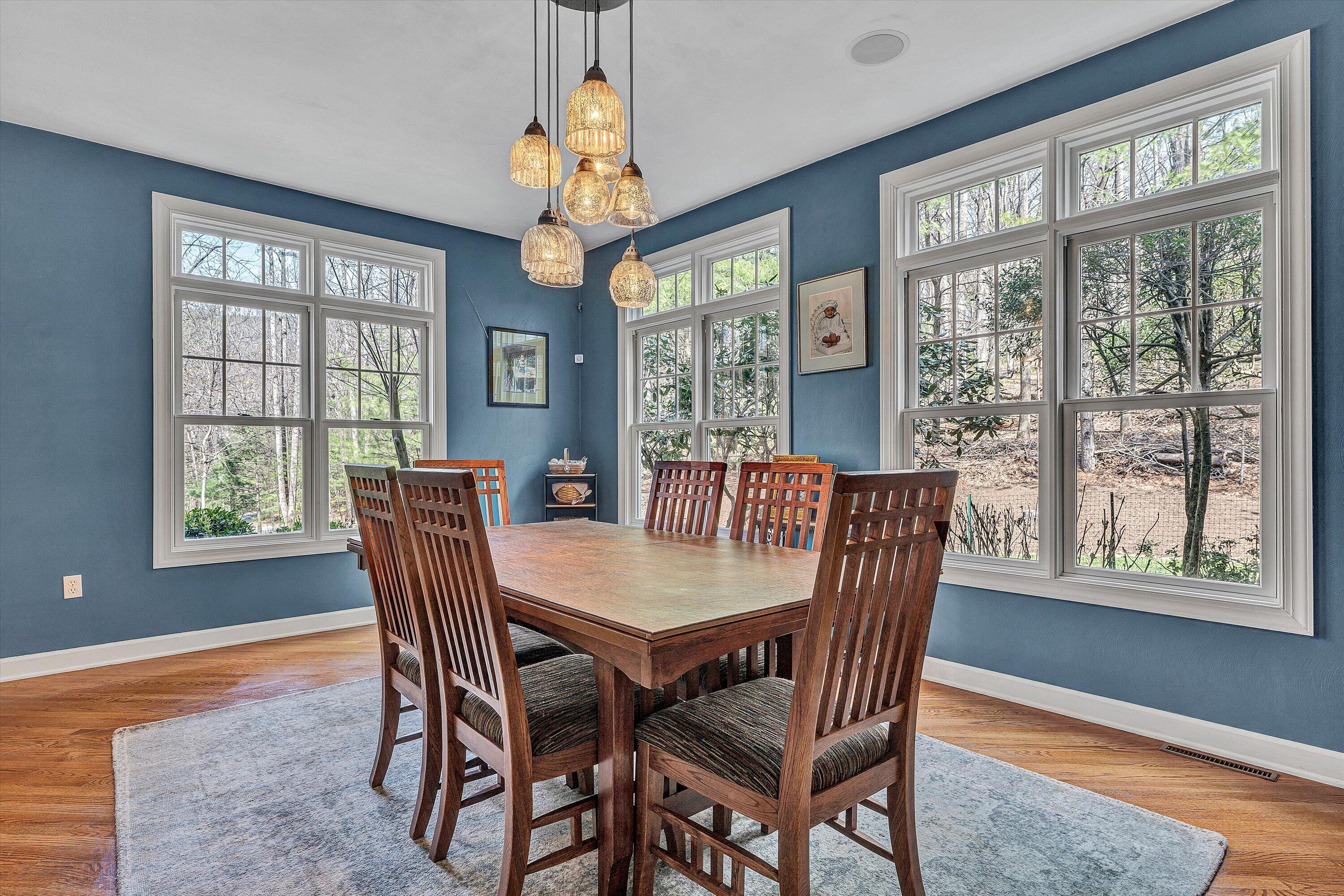 5671 Split Rail Lane Roanoke, VA 24018 - Photo 21 of 71 a view of a dining room with furniture a chandelier and wooden floor