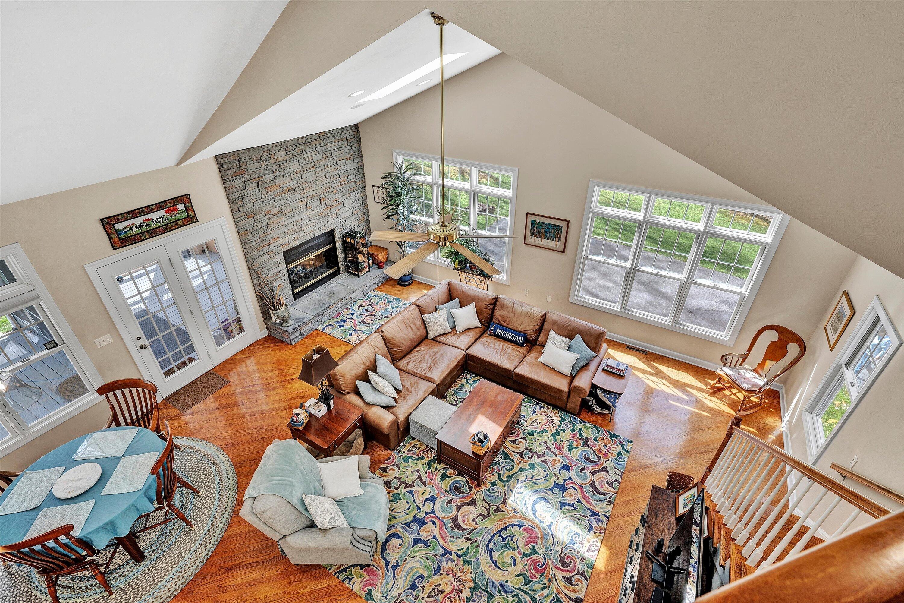 5671 Split Rail Lane Roanoke, VA 24018 - Photo 33 of 71 a living room with furniture and a floor to ceiling window