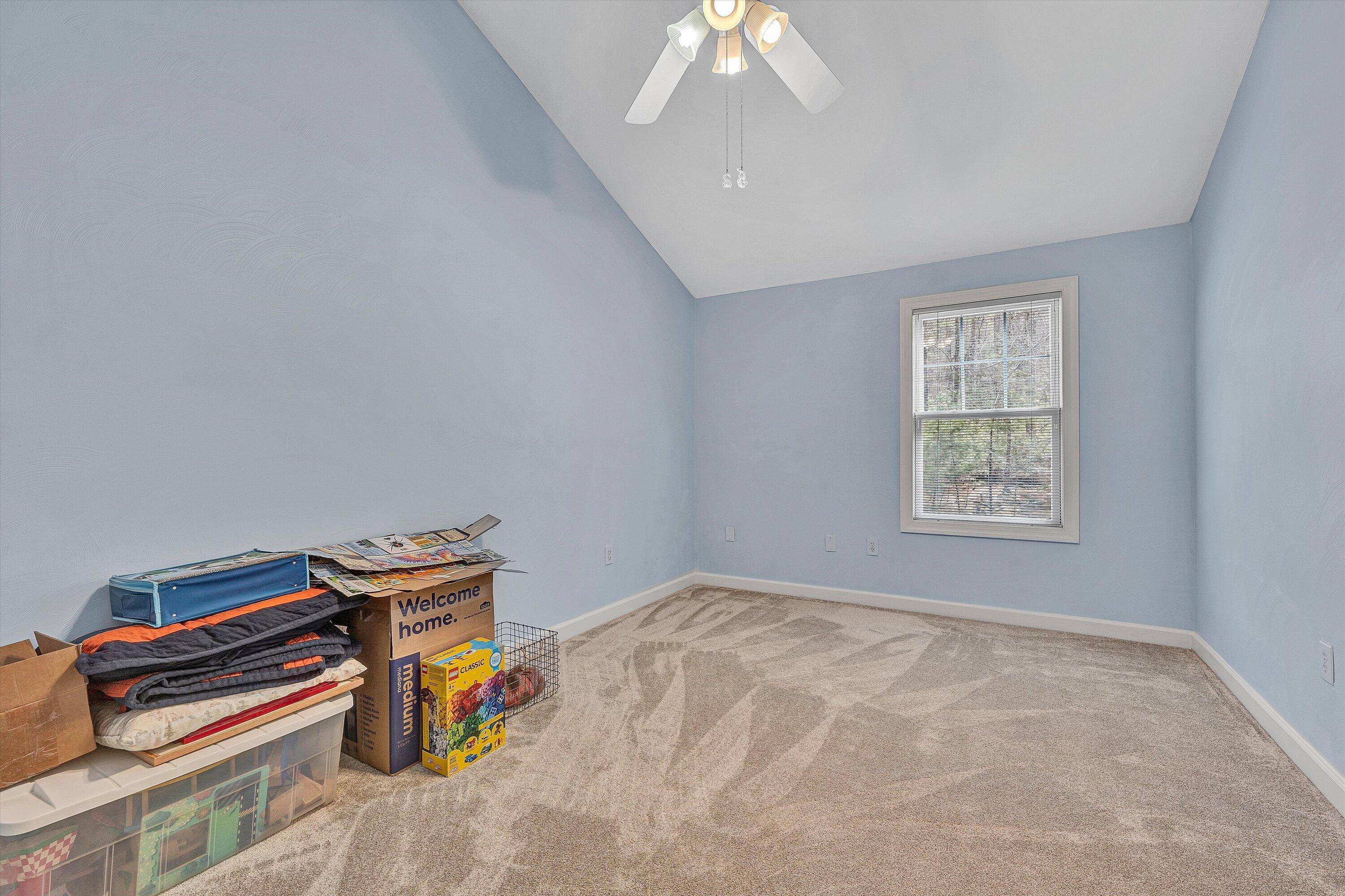 5671 Split Rail Lane Roanoke, VA 24018 - Photo 35 of 71 a bedroom with a bed and a chandelier
