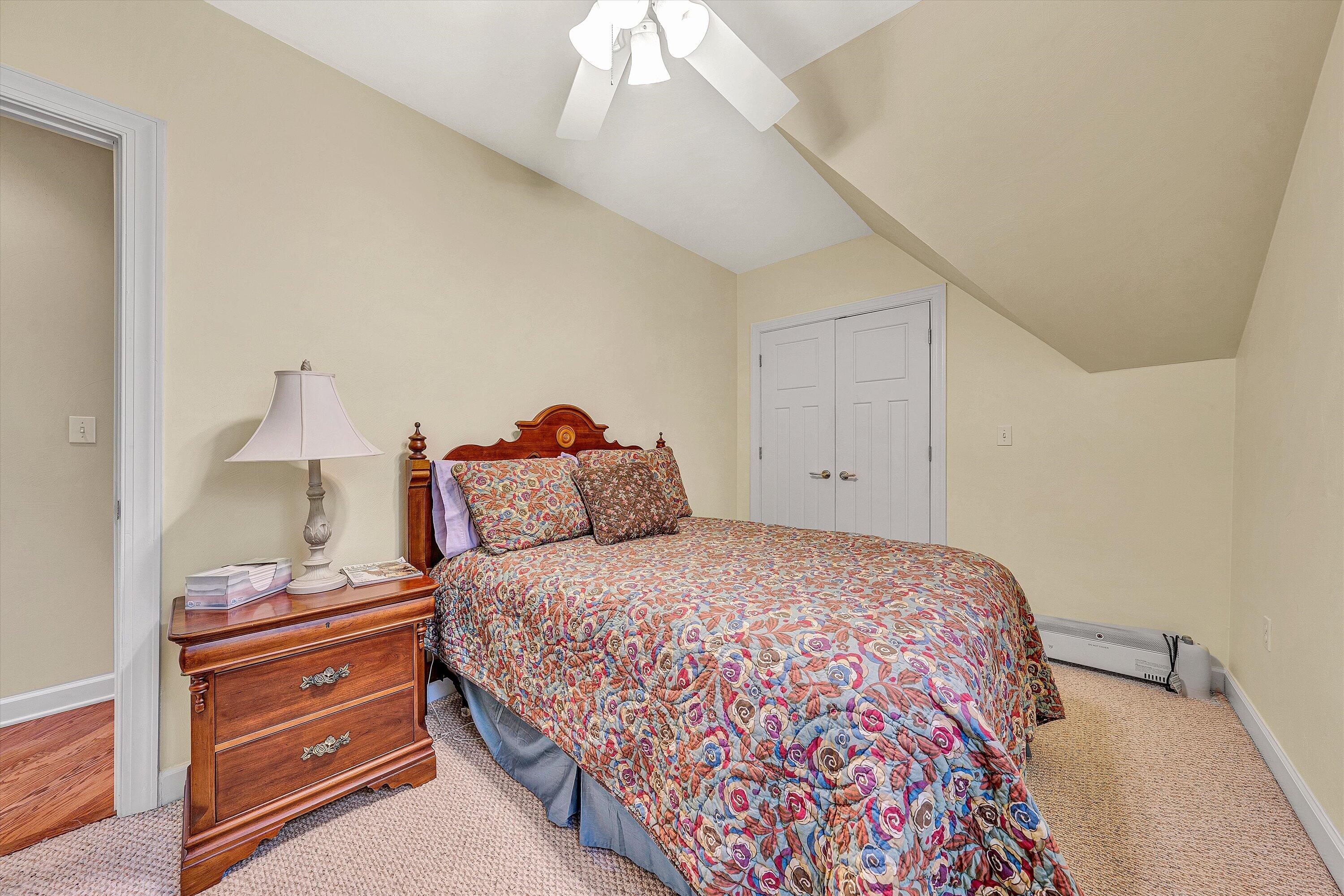 5671 Split Rail Lane Roanoke, VA 24018 - Photo 36 of 71 a bedroom with a bed and a lamp on dresser
