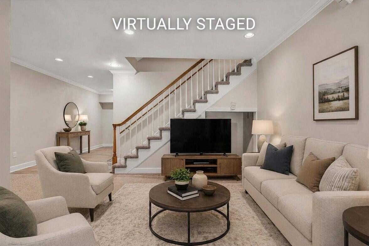 5671 Split Rail Lane Roanoke, VA 24018 - Photo 43 of 71 a living room with furniture a flat screen tv and a floor to ceiling window