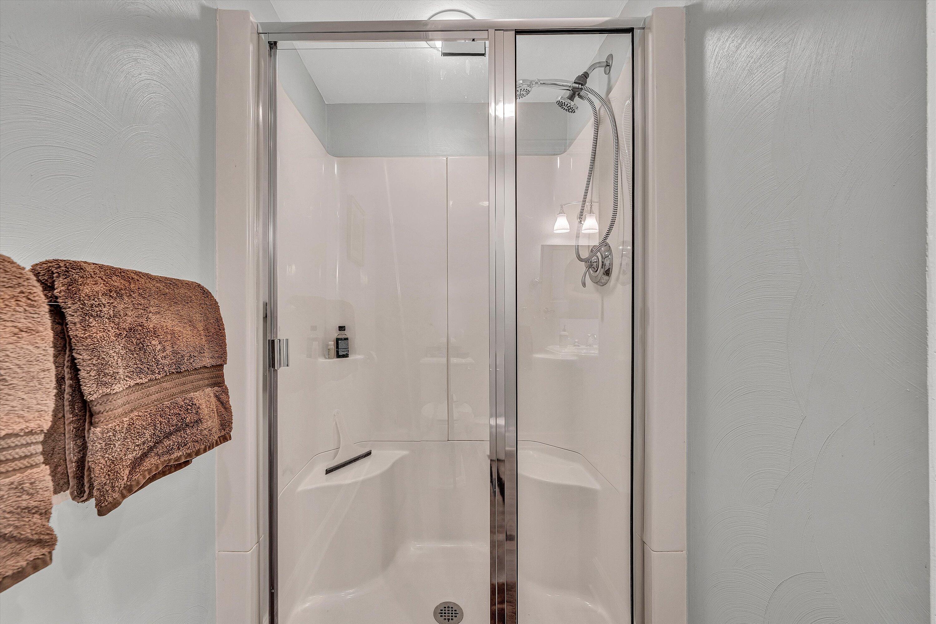 5671 Split Rail Lane Roanoke, VA 24018 - Photo 47 of 71 a bathroom with a glass shower door and a mirror