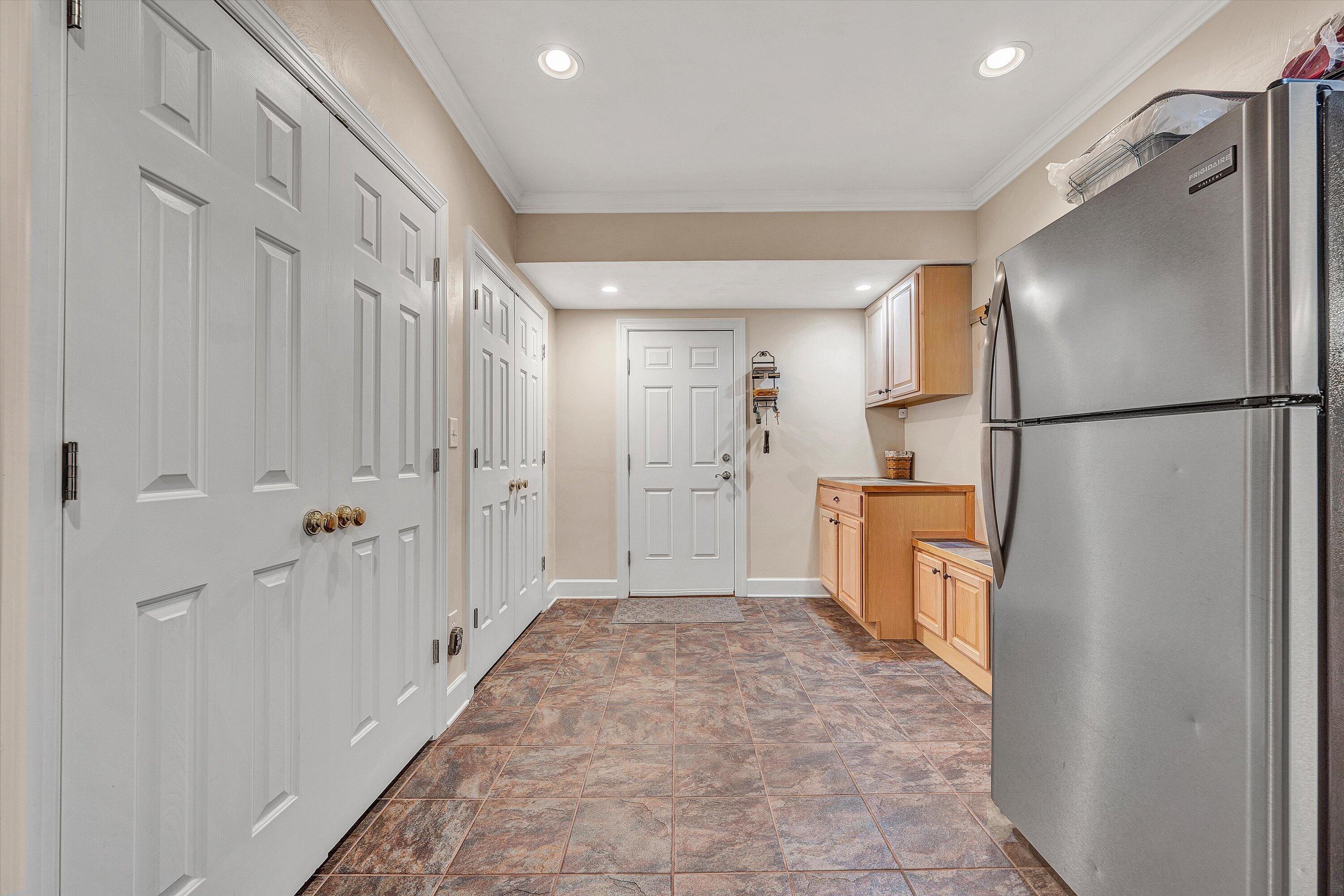 5671 Split Rail Lane Roanoke, VA 24018 - Photo 48 of 71 a view of a refrigerator in kitchen and an empty room