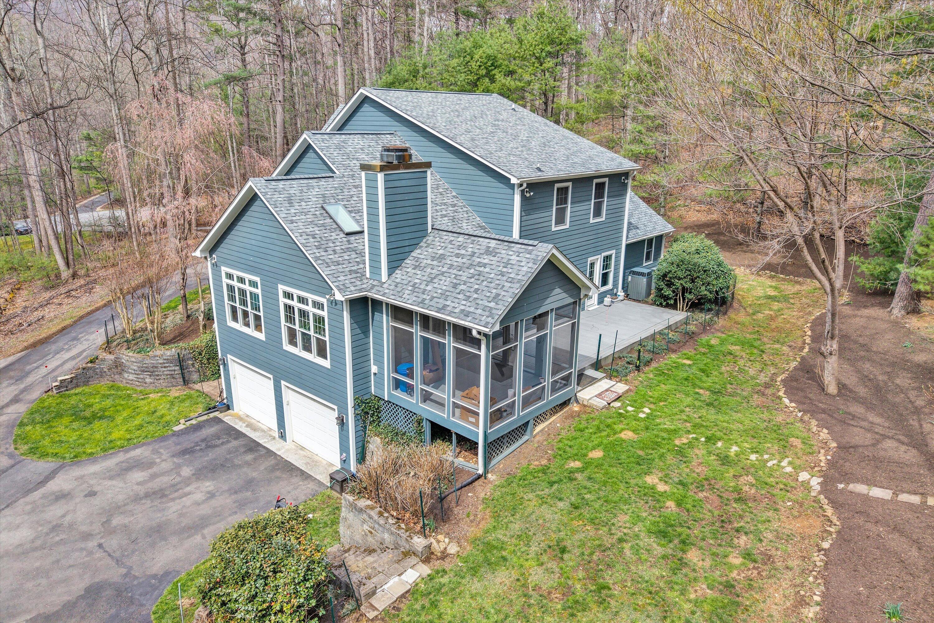 5671 Split Rail Lane Roanoke, VA 24018 - Photo 5 of 71 a aerial view of a house that has a small yard and large trees