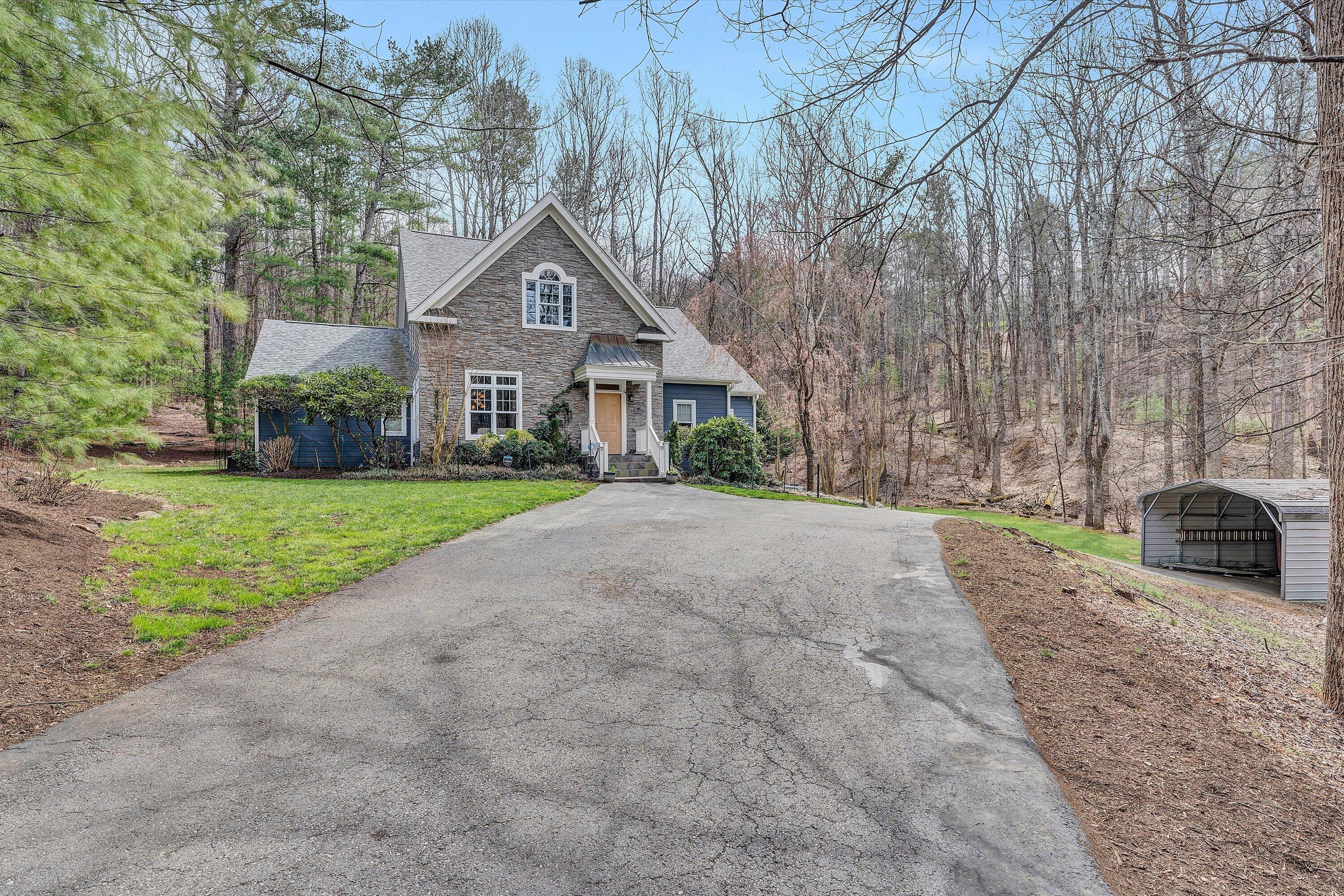 5671 Split Rail Lane Roanoke, VA 24018 - Photo 52 of 71 a front view of a house with a yard and garage
