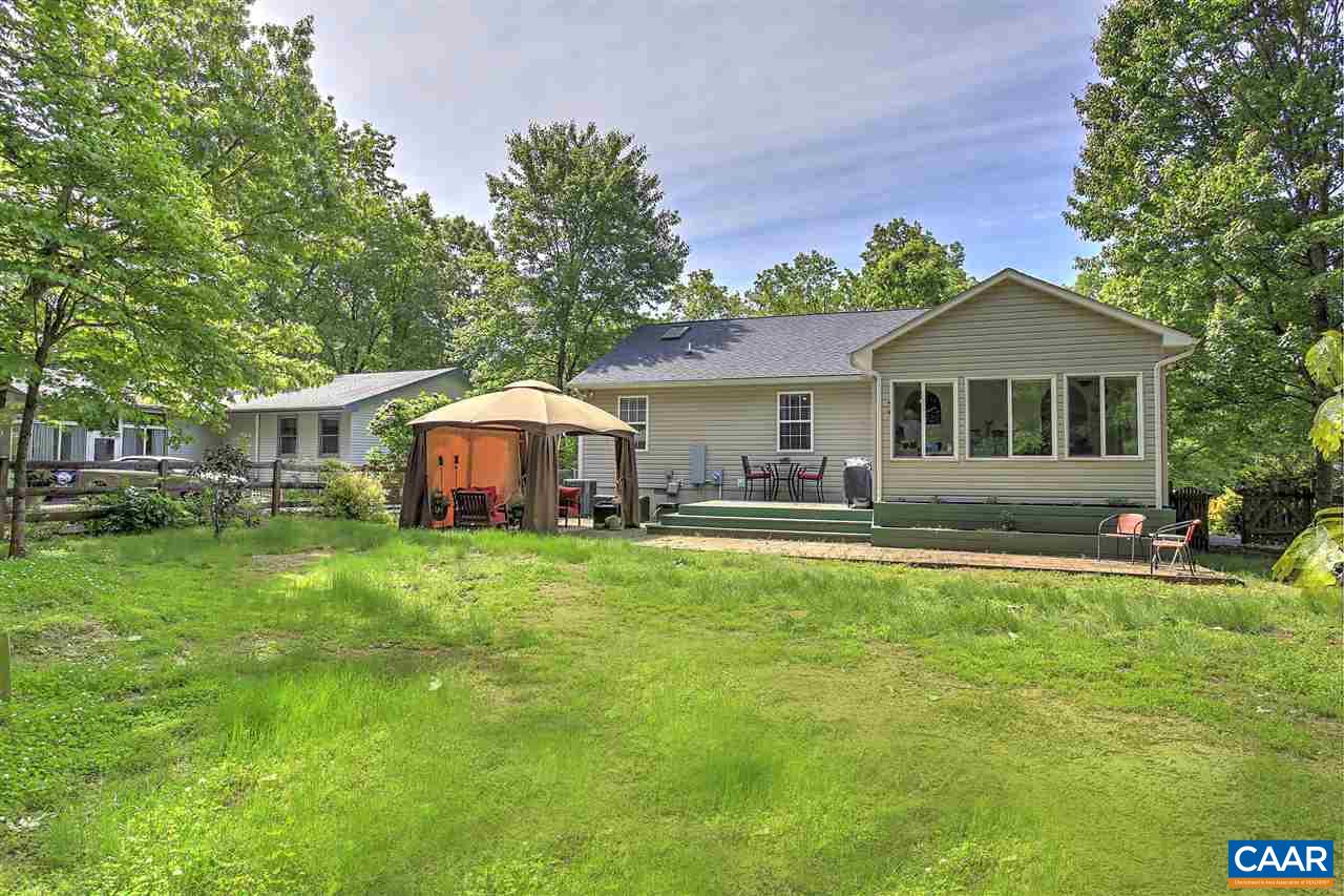 45 Stonewall Road Palmyra, VA 22963 - Photo 8 of 26 a front view of a house with a yard porch and furniture