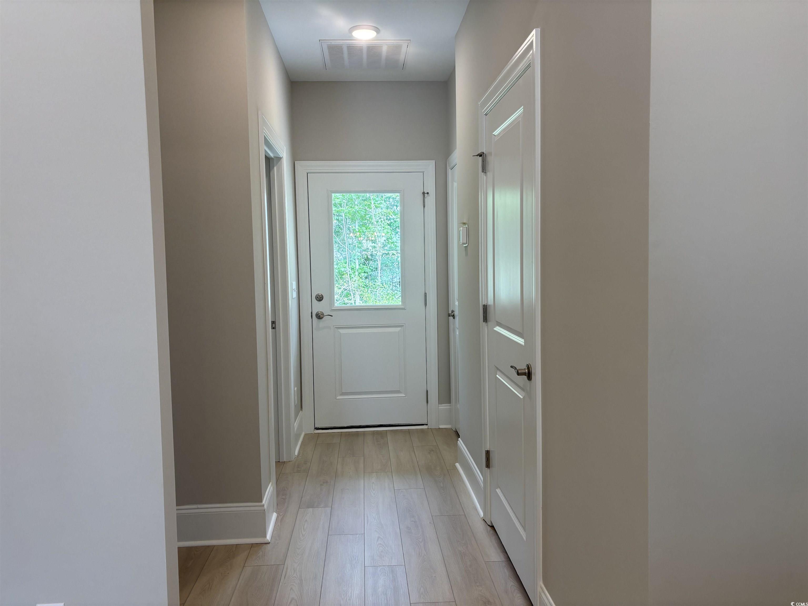 3125 Tiger Tail Road Conway, SC 29526 - Photo 10 of 37 Entryway featuring baseboards and light wood-type flooring