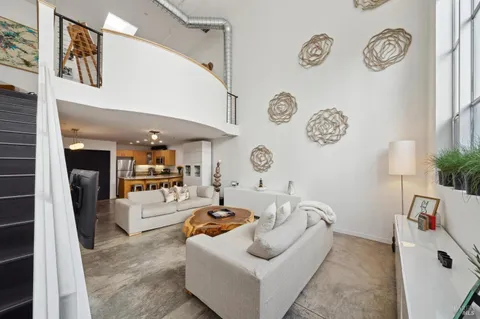 a living room with furniture and a clock