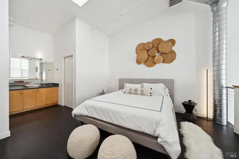 a bedroom with a bed and a couch