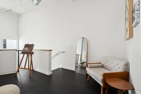 a view of a livingroom with furniture and wooden floor