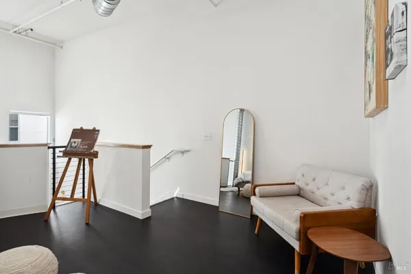 a view of a livingroom with furniture and wooden floor