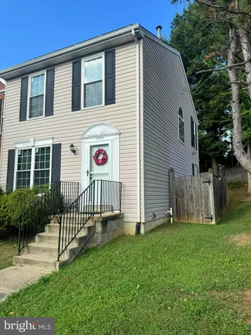 a view of backyard with a garden and deck