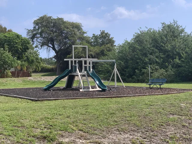 a view of a park with swings