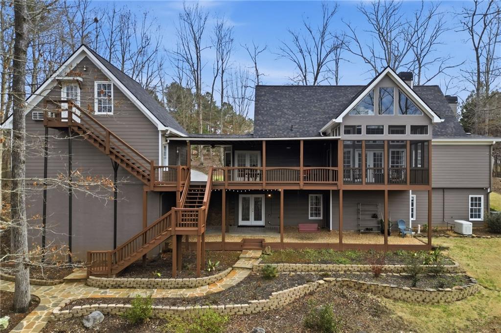 217 Wild Turkey Ridge Ball Ground, GA 30107 - Photo 11 of 55 a front view of a house with a yard