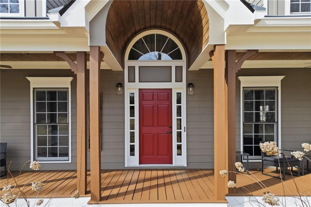 217 Wild Turkey Ridge Ball Ground, GA 30107 - Photo 2 of 55 a front view of a house with a glass door