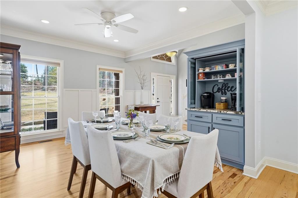 217 Wild Turkey Ridge Ball Ground, GA 30107 - Photo 22 of 55 a view of a dining room with furniture and wooden floor
