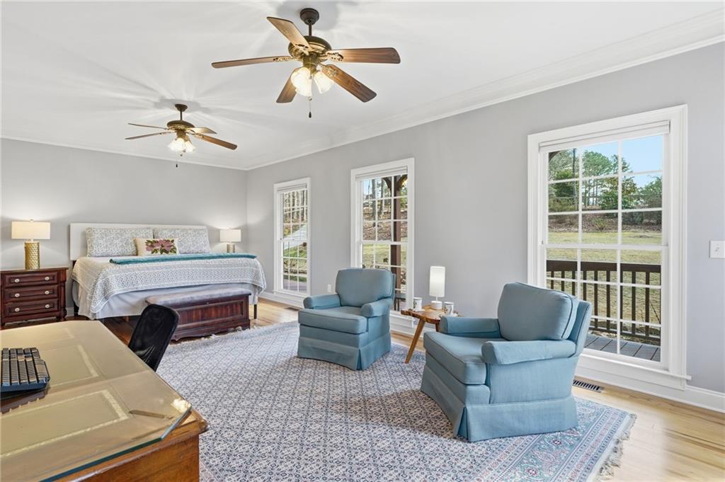 217 Wild Turkey Ridge Ball Ground, GA 30107 - Photo 25 of 55 a living room with furniture ceiling fan and a window