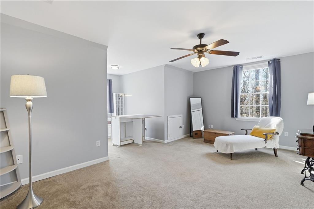 217 Wild Turkey Ridge Ball Ground, GA 30107 - Photo 32 of 55 a living room with furniture and a chandelier