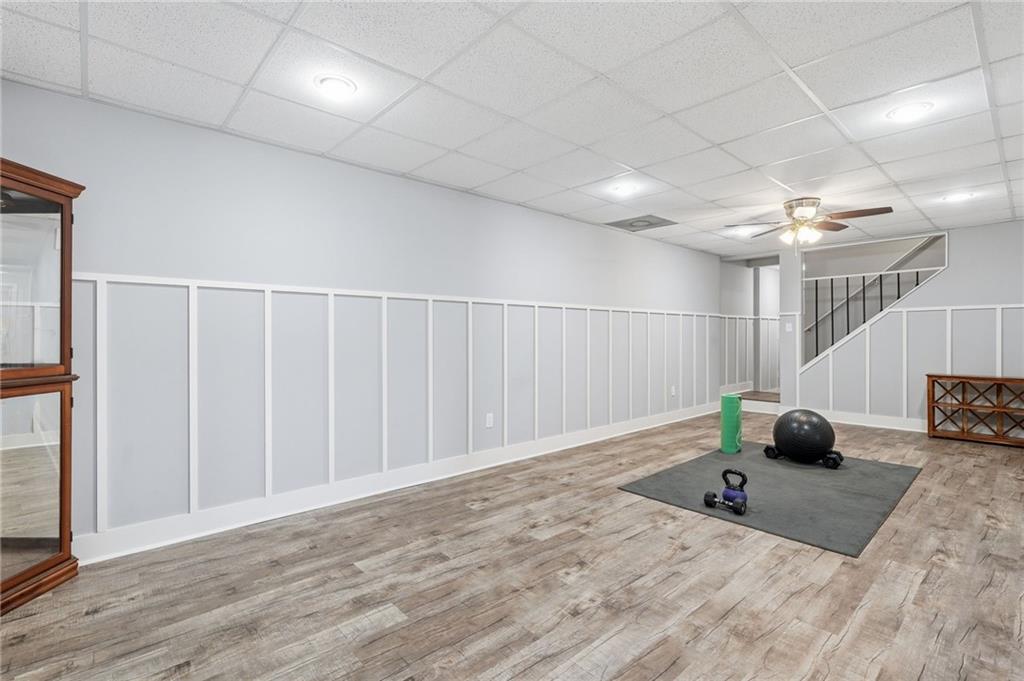 217 Wild Turkey Ridge Ball Ground, GA 30107 - Photo 38 of 55 a bedroom with a bed and a chandelier