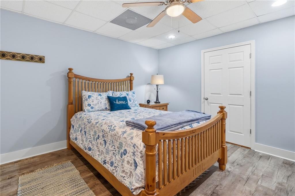 217 Wild Turkey Ridge Ball Ground, GA 30107 - Photo 40 of 55 a bed sitting in a bedroom next to a window