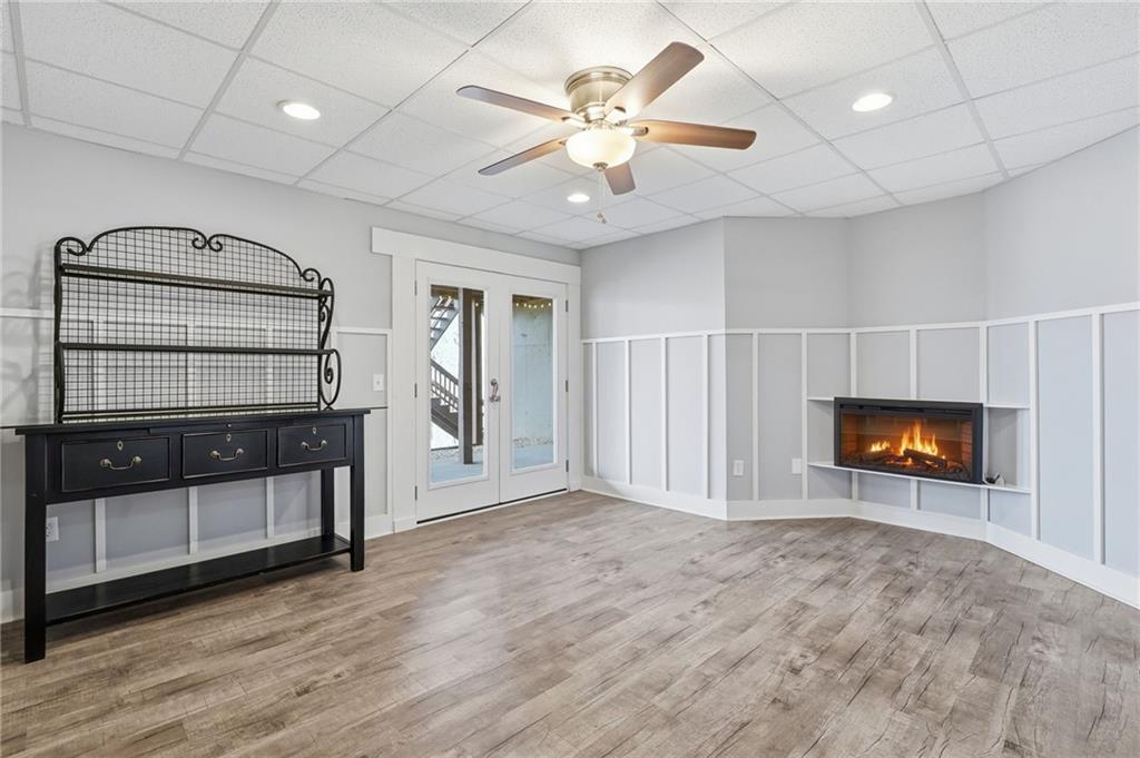 217 Wild Turkey Ridge Ball Ground, GA 30107 - Photo 42 of 55 an empty room with windows and fireplace
