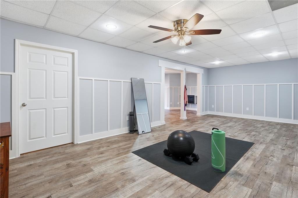 217 Wild Turkey Ridge Ball Ground, GA 30107 - Photo 44 of 55 a living room with furniture and a ceiling fan