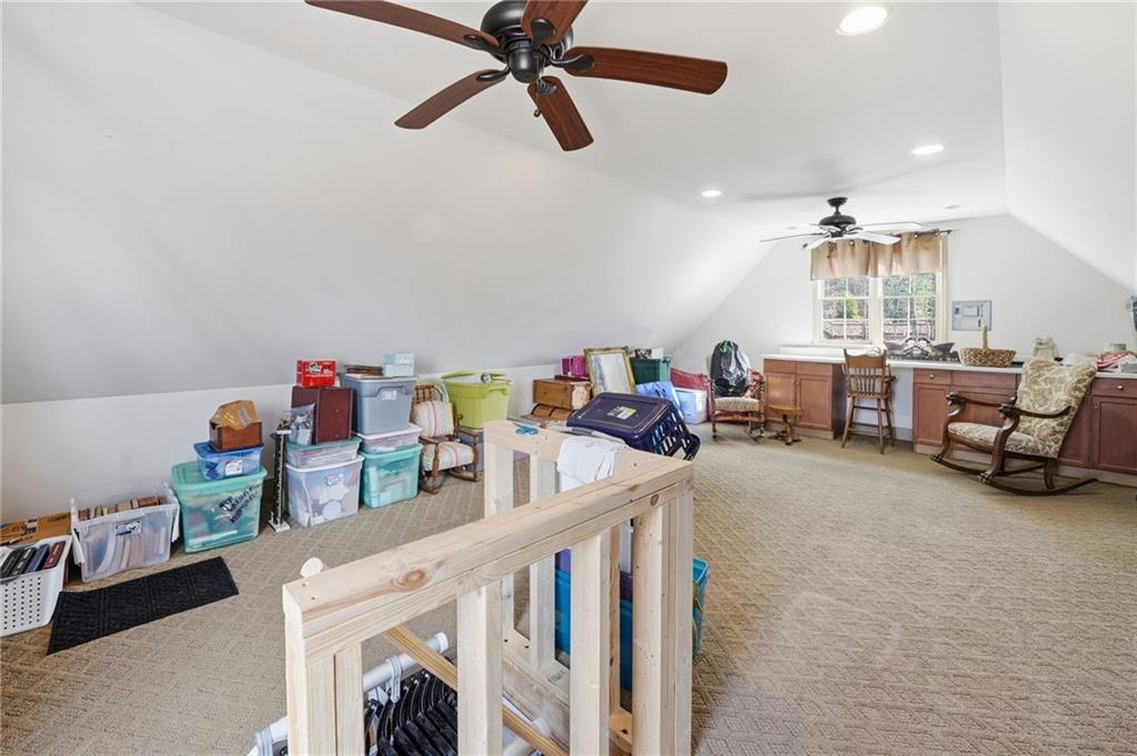 217 Wild Turkey Ridge Ball Ground, GA 30107 - Photo 45 of 55 a view of a dining room with furniture and a chandelier