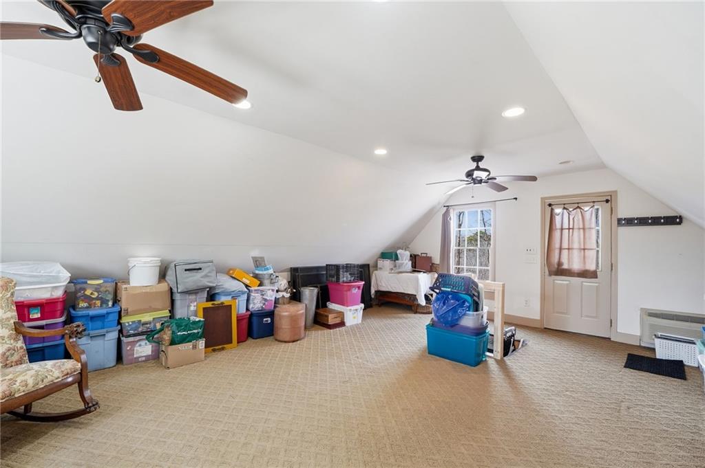 217 Wild Turkey Ridge Ball Ground, GA 30107 - Photo 46 of 55 a view of a livingroom with furniture and a ceiling fan