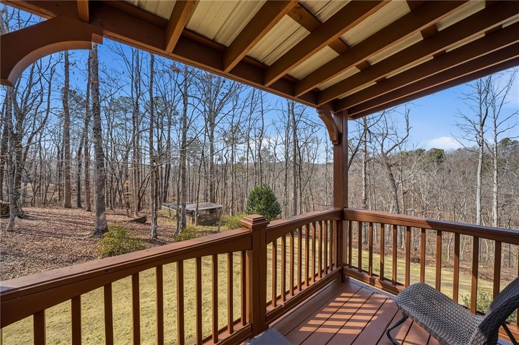217 Wild Turkey Ridge Ball Ground, GA 30107 - Photo 47 of 55 a view of balcony with wooden floor and outdoor space